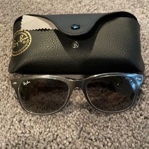 Sunglasses (not polarized). Used like new. Case and cloth cleaner included